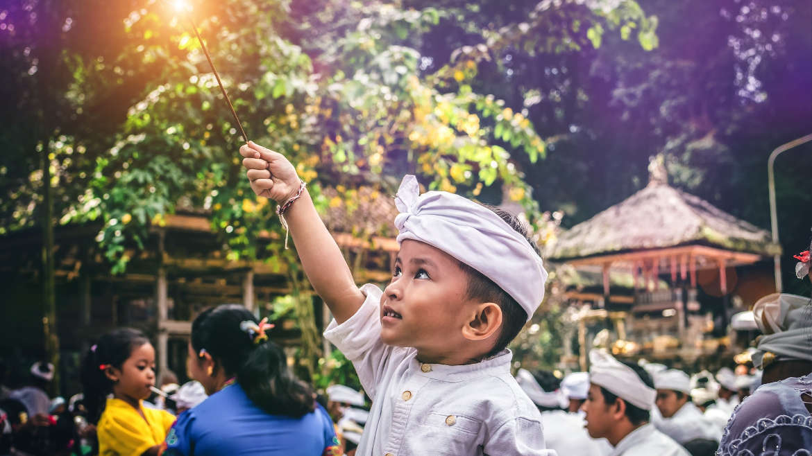 Little boy holding a firecracker sparkler