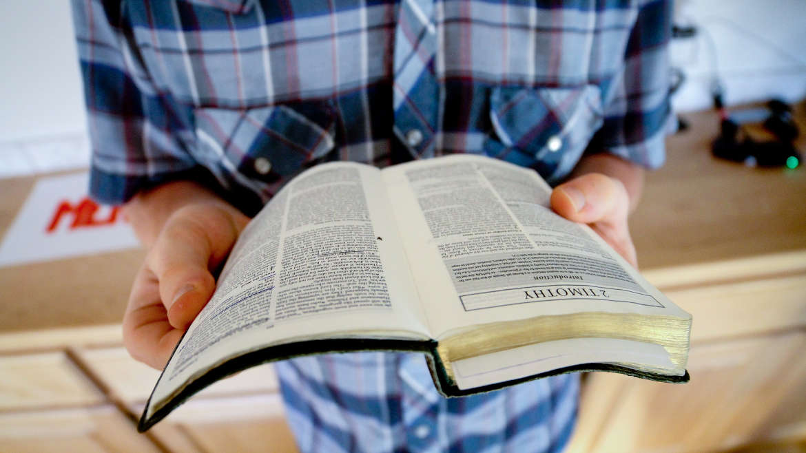 Person reading a Bible