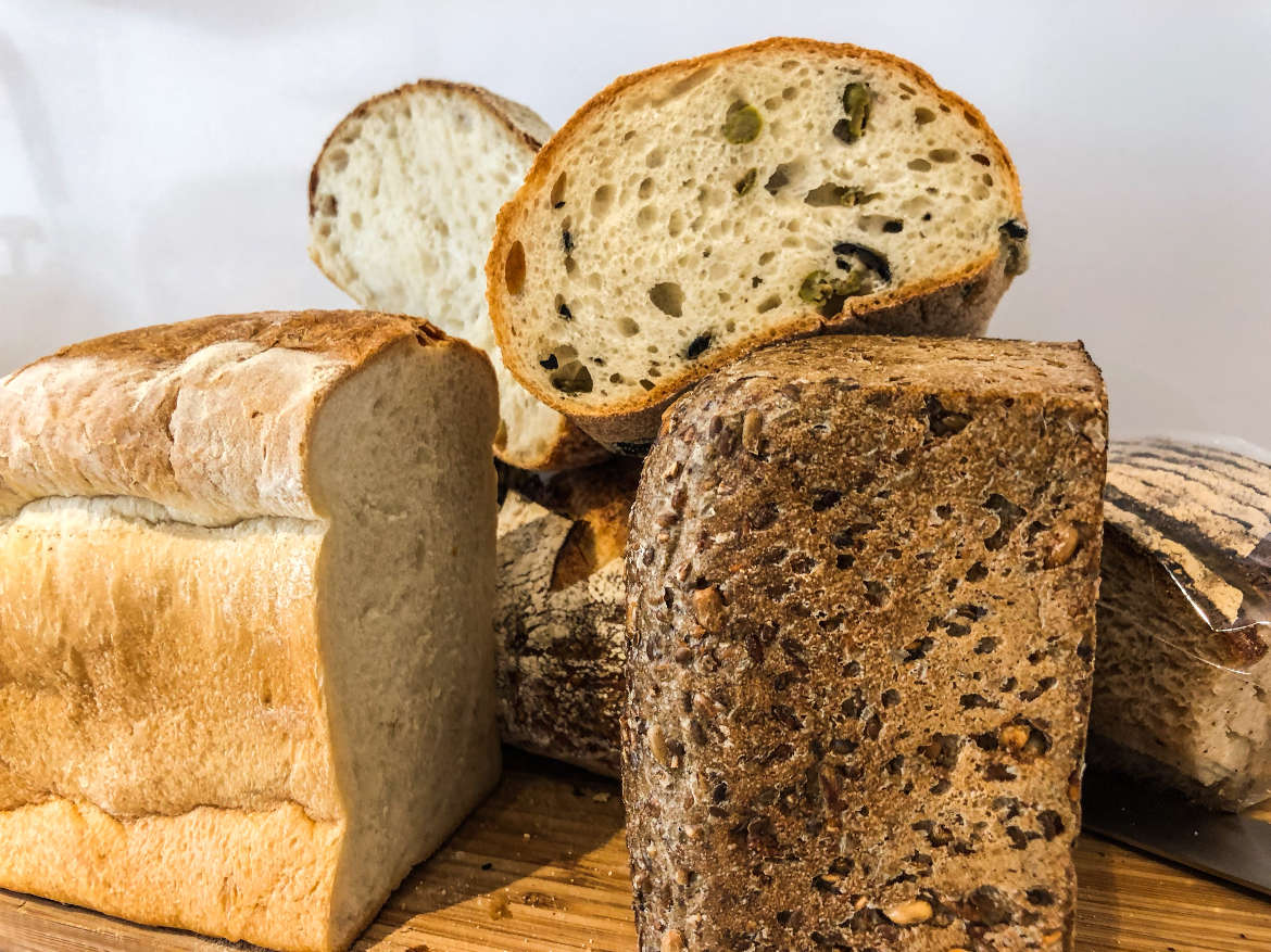 Pile of different types of sliced bread