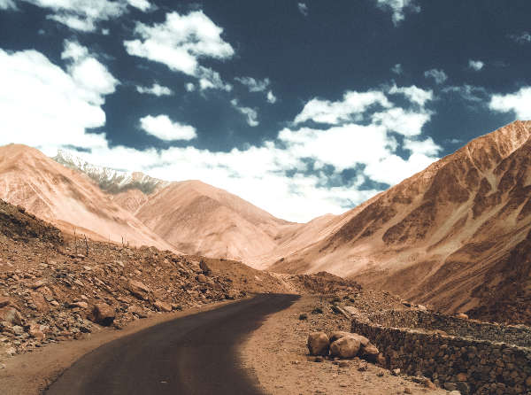 Winding road in the desert among mountains