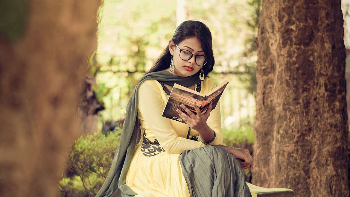 Woman reading a devotional book